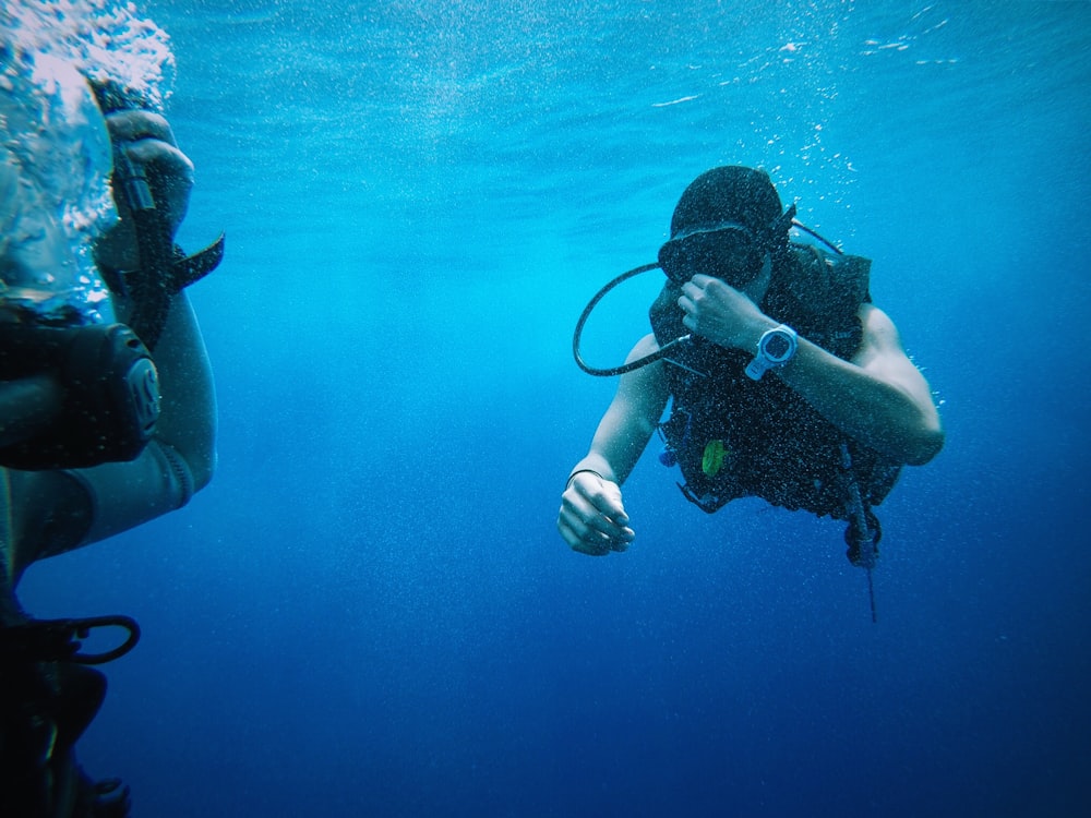 person scuba underwater