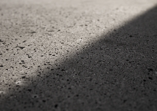 Finished concrete surface showing smooth texture and clean edges under sunlight.