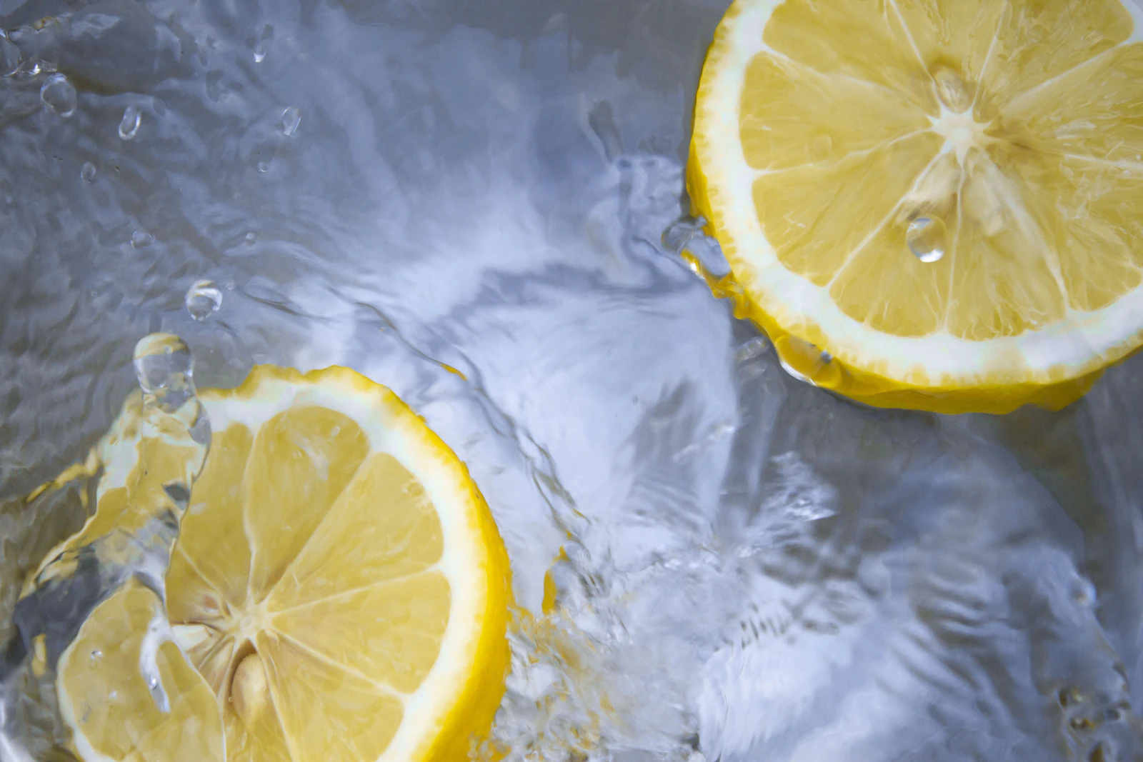 Lemon slices floating in clear water
