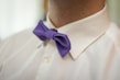 A close-up of a light blue formal shirt with crisp collar details.
