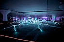 linked neon lights under white painted basement