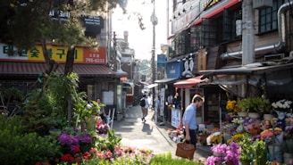 Walkable neighborhood streets bustling with local shops and greenery.