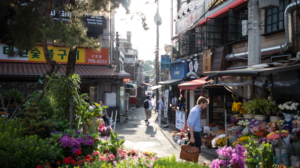 A vibrant street scene in Elk Grove showing local storefronts and friendly pedestrians.