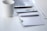 A clean workspace with a laptop and a notepad, symbolizing creativity and productivity.