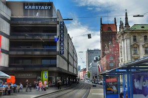 Street scene showing nearby shops and cafes in the lively Ottakring neighborhood.