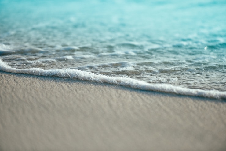 Ocean foam on a sand beach