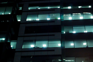 Nighttime view of a professional cleaning team working inside a modern office building in Reno.