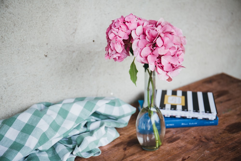 clear glass vase with pink flowers