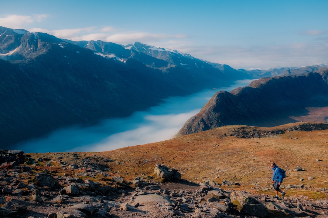 person walking on mountain, Hiking Alone
