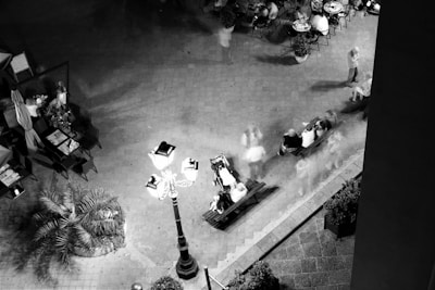 An outdoor shot of a local café bustling with customers during golden hour.