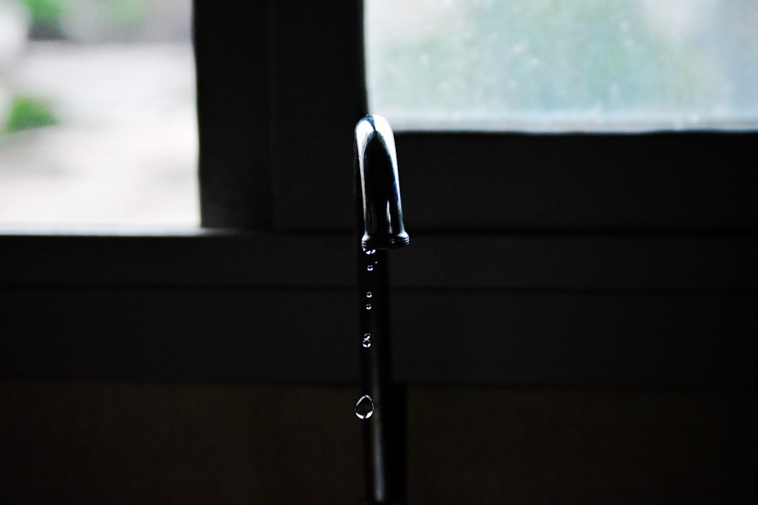 A leaky faucet dripping water in Bessengue, tap and window bessengue