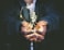man holding incandescent bulb