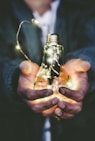 man holding incandescent bulb