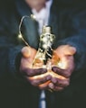 man holding incandescent bulb