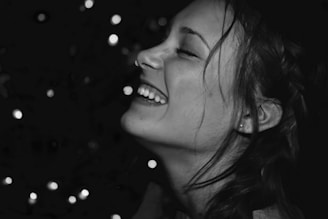 A motivational image of a happy woman celebrating her weight loss journey.