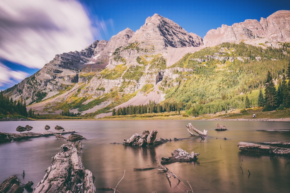 landscape photography of mountains near body of water