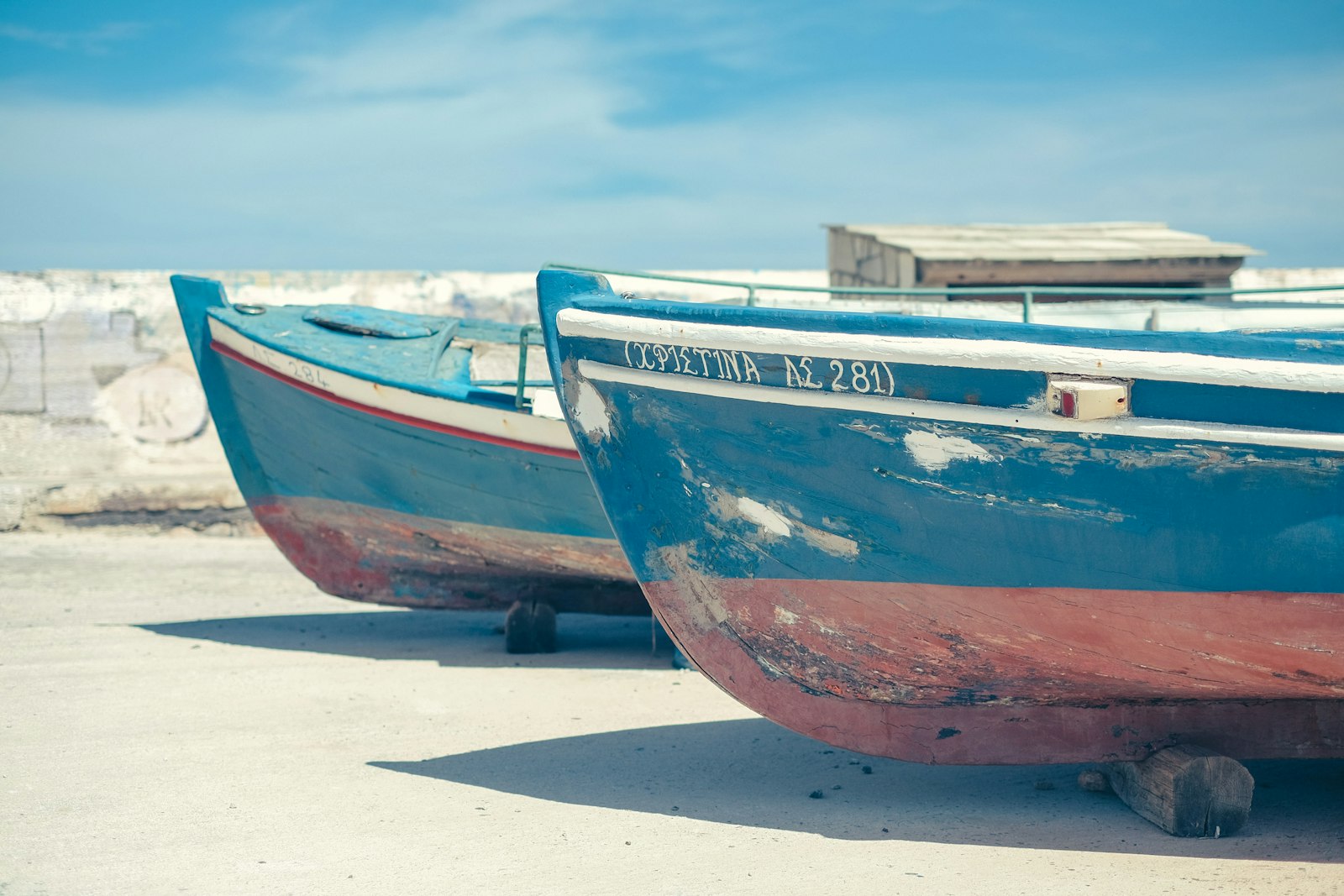 Fujifilm X-T10 + Fujifilm XF 35mm F1.4 R sample photo. Two blue-and-brown boat beside photography