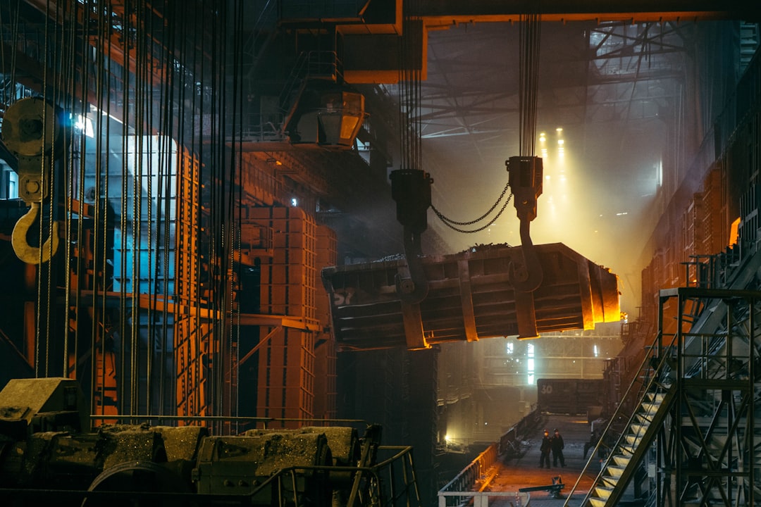 two person standing near wall, Busy day at the steelworks