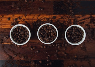 A variety of coffee beans and cups.
