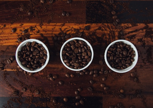 A variety of coffee beans and cups.