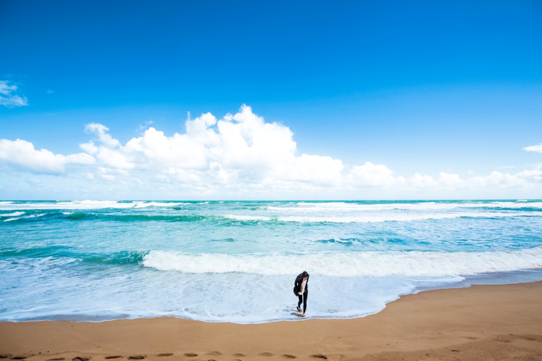 person standing near shore