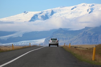 white SUV passing through roadway