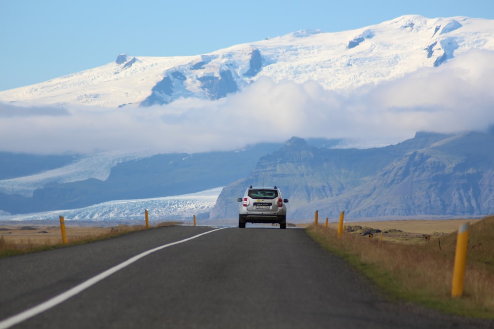 white SUV passing through roadway