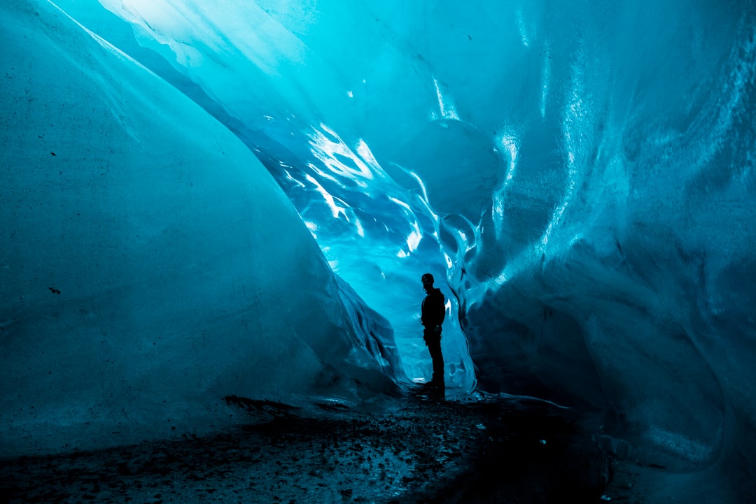 Man in an ice cave in Iceland - Photo by Davide Cantelli | best digital marketing - London, Bristol and Bath marketing agency