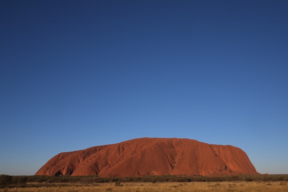 brown mountain under blue sky during daytime