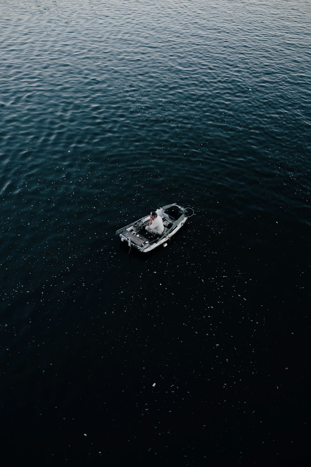 man in gray canoe boat