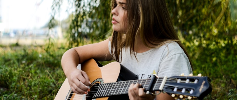 woman playing gitar