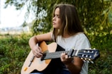 woman playing gitar