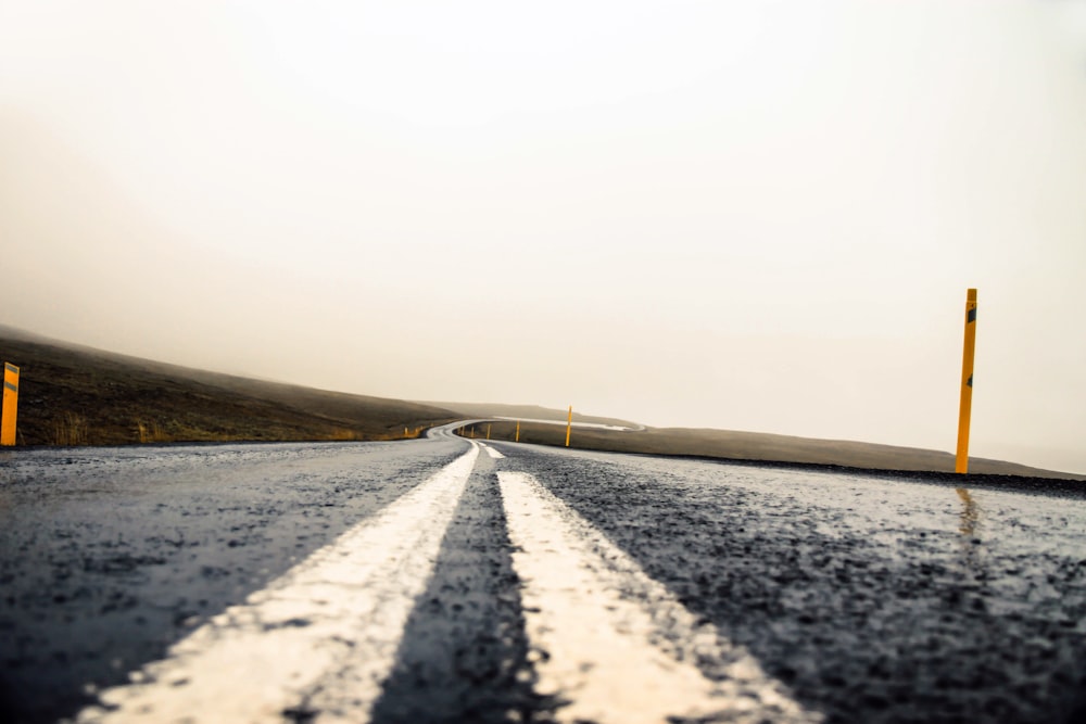 highway leading to area covered in fog