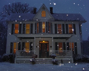 Cozy house with a family inside, seen through a large window