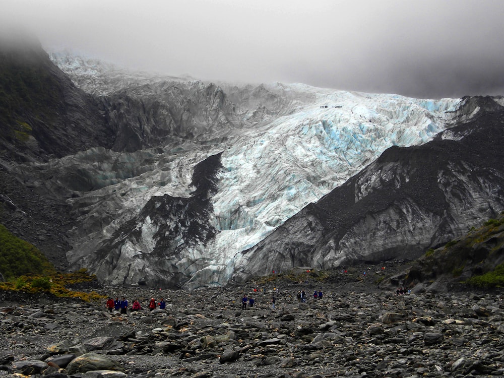 people walking near mountain