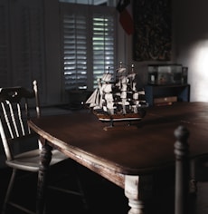 ship miniature on table
