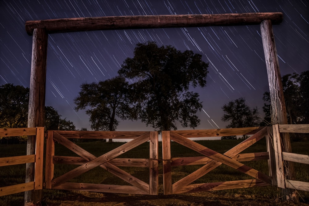 worm's eye view photography of brown wooden barn doors