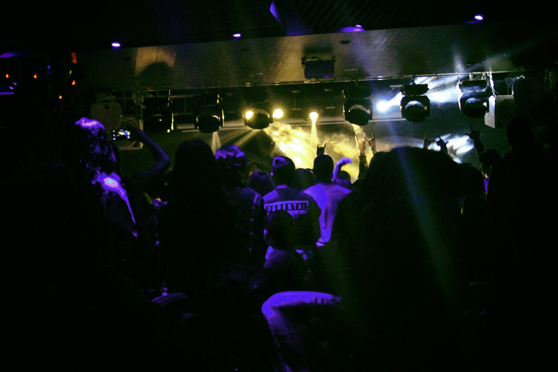 woman wearing yellow long-sleeved dress under white clouds and blue sky during daytime