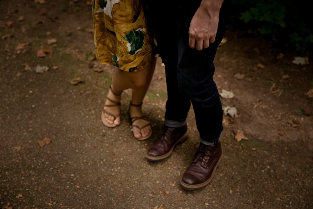 man standing beside woman