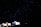 A starry night sky dominates the scene, with thousands of stars twinkling in the darkness. Below, several illuminated tents are pitched, creating a cozy and inviting atmosphere. The contrast between the bright tents and the dark sky highlights the tranquility of a night spent camping.