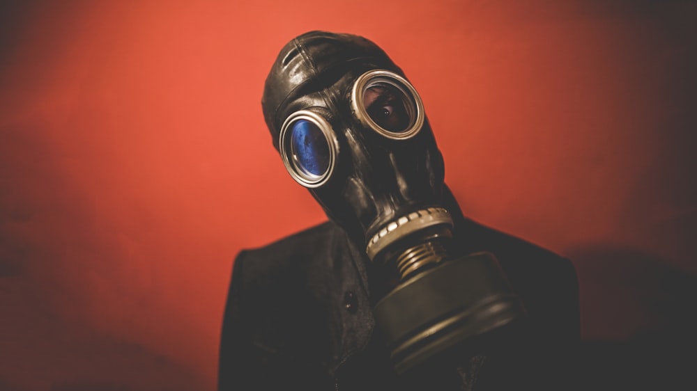 A person wearing a gas mask helmet.