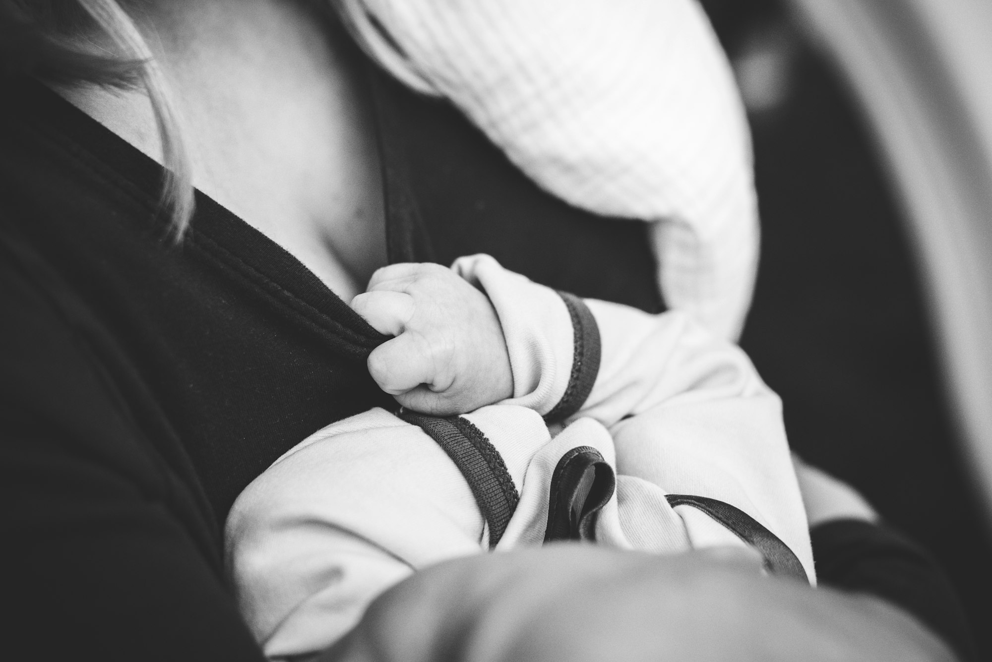 black and white baby and mother, mother and child, mother holding baby