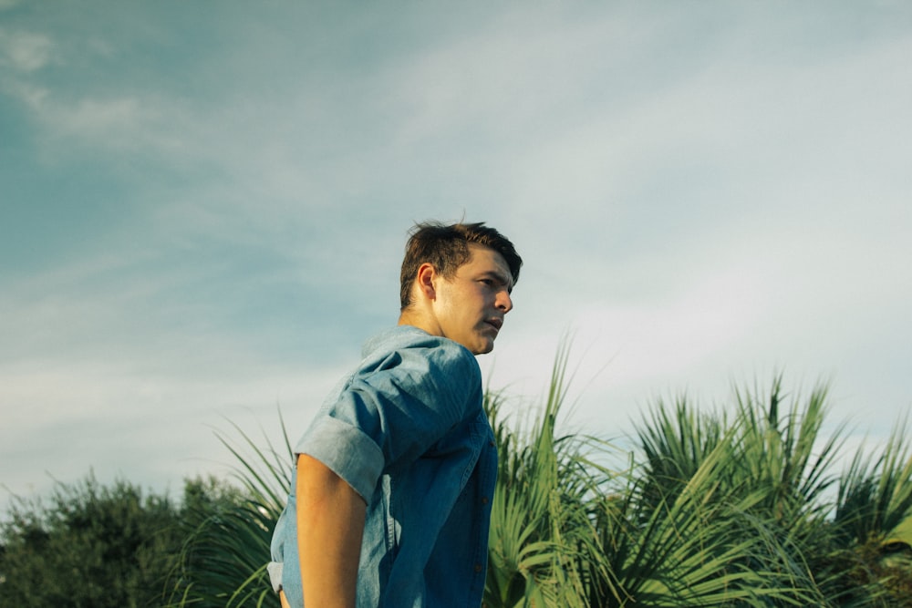 man wearing blue chambray top