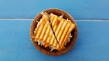 two slices of sandwich on brown container