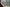 tilt-shift photography of person in brown jacket