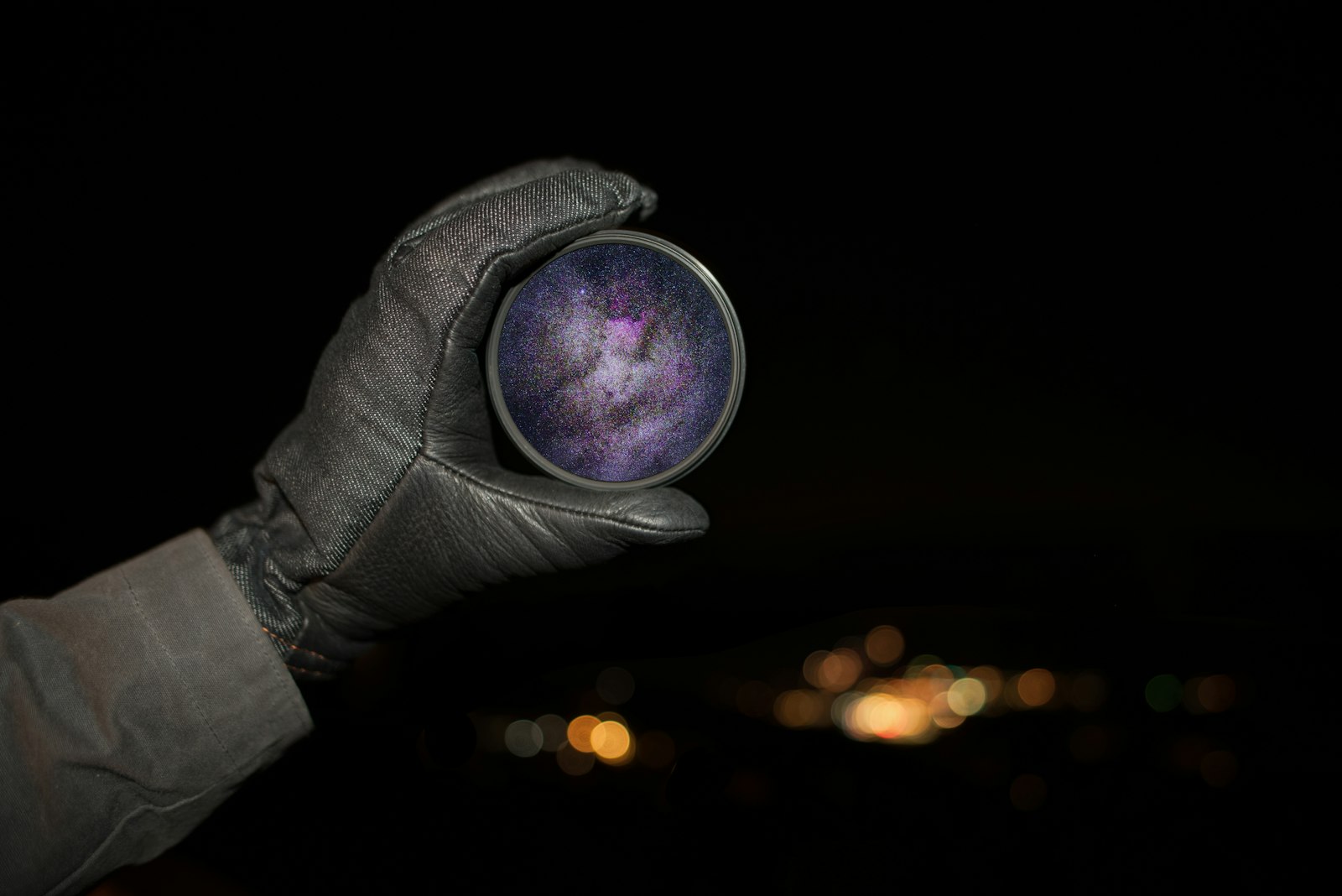 Nikon AF-S Nikkor 20mm F1.8G ED sample photo. Person holding round purple photography