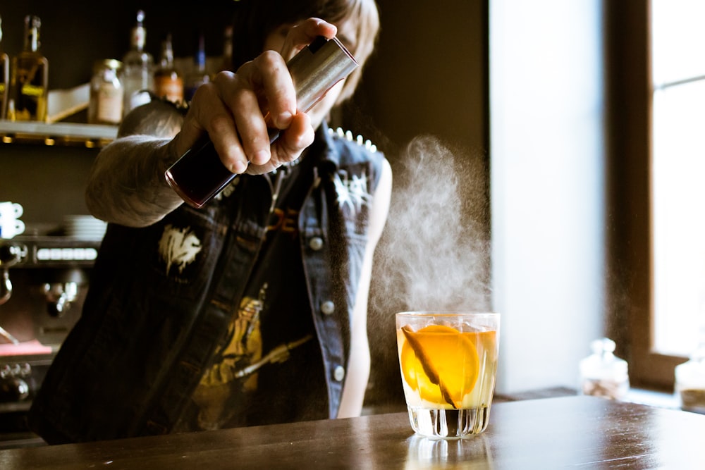 bartender holding spray bottle