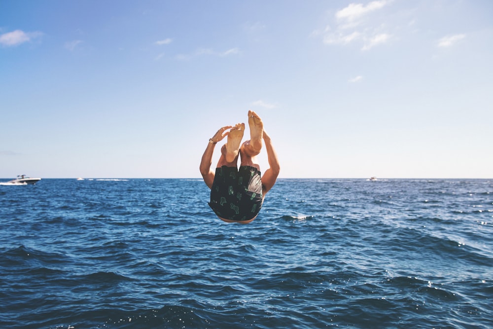 man back tumbling during daytime