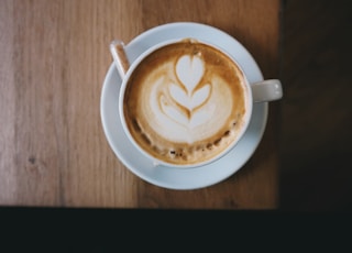 white ceramic cup with espresso coffee