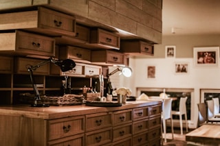 black and brown steam punk lamps on brown sideboard